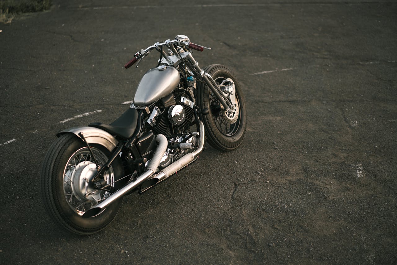 Black and Silver Cruiser Motorcycle on Asphalt Road